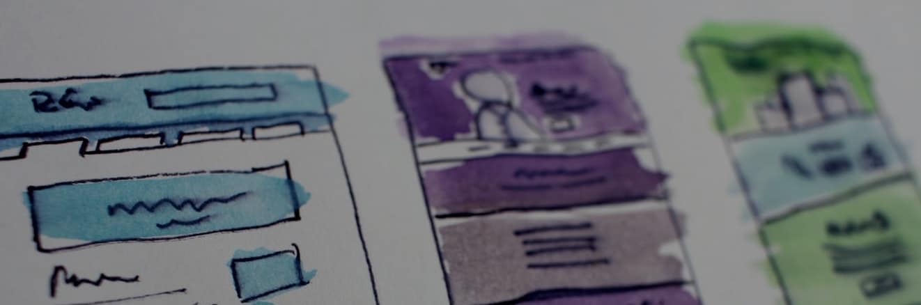 Watercolor and pen sketches of website wireframe mockups.